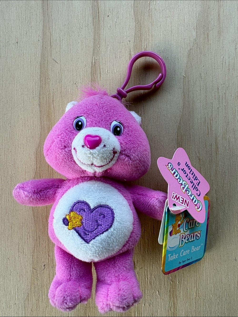 Care Bears Pink Plush Clip-On Bear with Purple Heart Badge